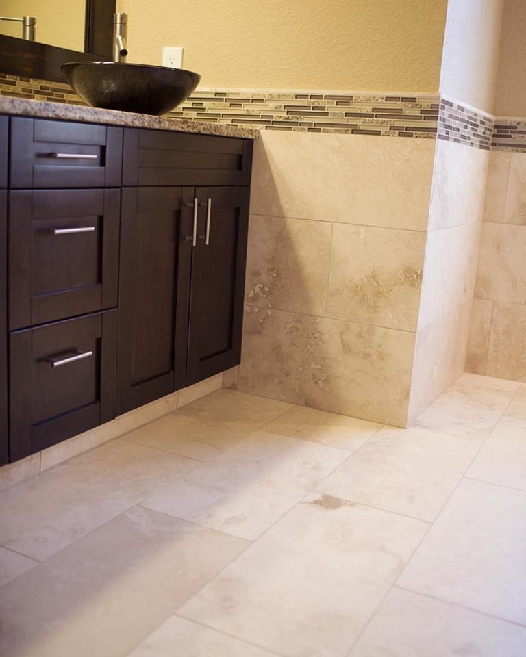 Inspiration for a medium sized contemporary ensuite bathroom in Tampa with shaker cabinets, brown cabinets, an alcove shower, a one-piece toilet, beige tiles, travertine tiles, beige walls, travertine flooring, a vessel sink, beige floors and a shower curtain.