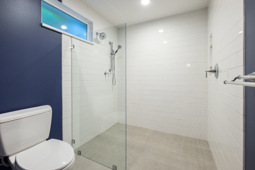 Mid-sized elegant master white tile and ceramic tile porcelain tile bathroom photo in Portland with recessed-panel cabinets, white cabinets, a two-piece toilet, blue walls, an undermount sink and quartz countertops