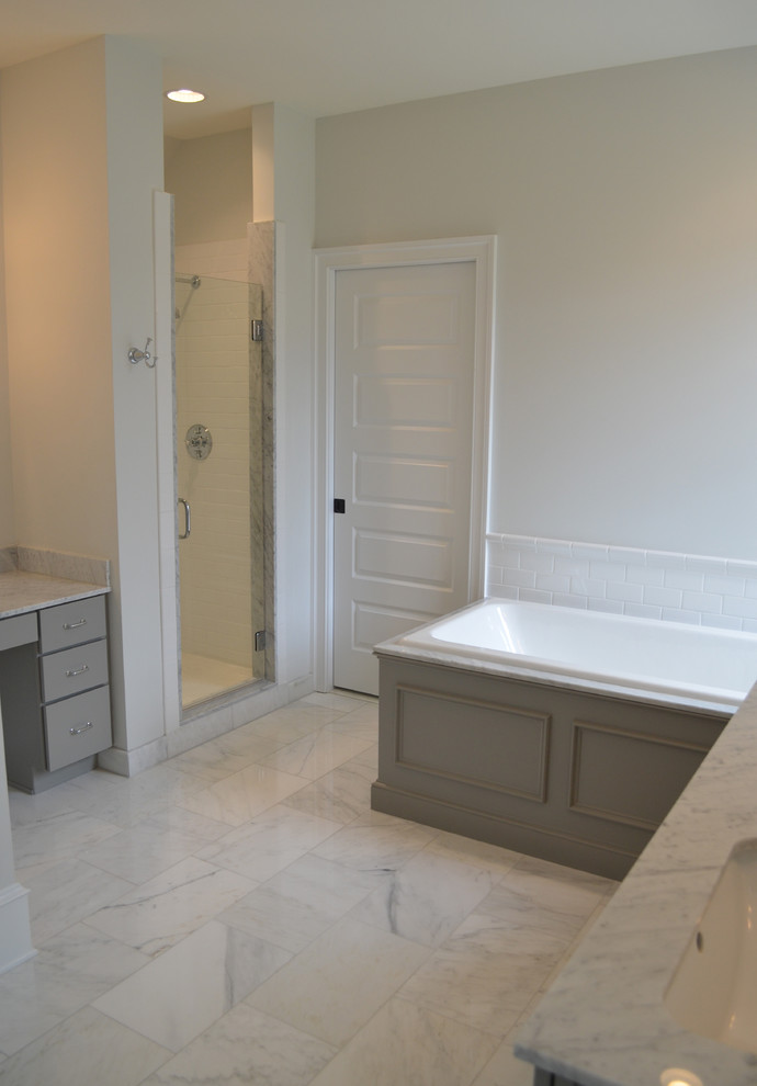 Large traditional ensuite bathroom in Wilmington with a submerged sink, recessed-panel cabinets, grey cabinets, marble worktops, a built-in bath, an alcove shower, white tiles, white walls and marble flooring.