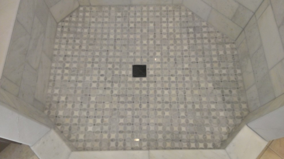 Design ideas for a contemporary bathroom in Austin with a corner shower, grey tiles and metro tiles.
