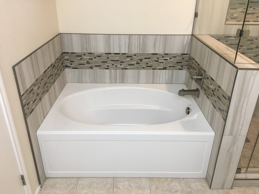 Inspiration for a medium sized traditional ensuite bathroom in Austin with recessed-panel cabinets, medium wood cabinets, an alcove bath, a corner shower, a two-piece toilet, grey tiles, porcelain tiles, beige walls, porcelain flooring, a submerged sink, granite worktops, beige floors, a hinged door and multi-coloured worktops.