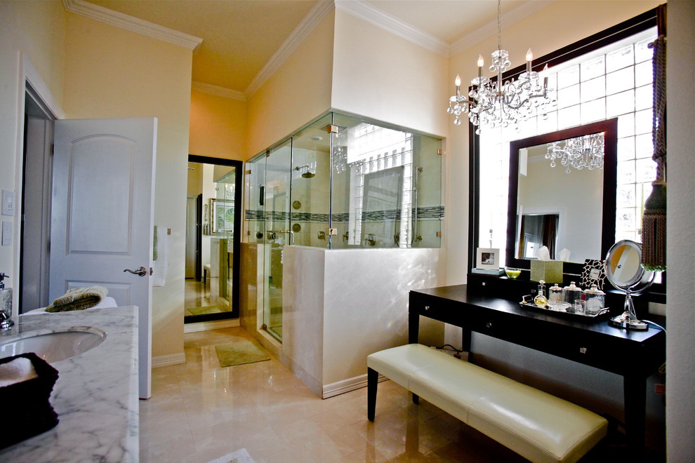 Photo of a large contemporary sauna bathroom in Orange County with freestanding cabinets, black cabinets, marble worktops, beige tiles, a submerged sink, a two-piece toilet, porcelain tiles, beige walls and porcelain flooring.
