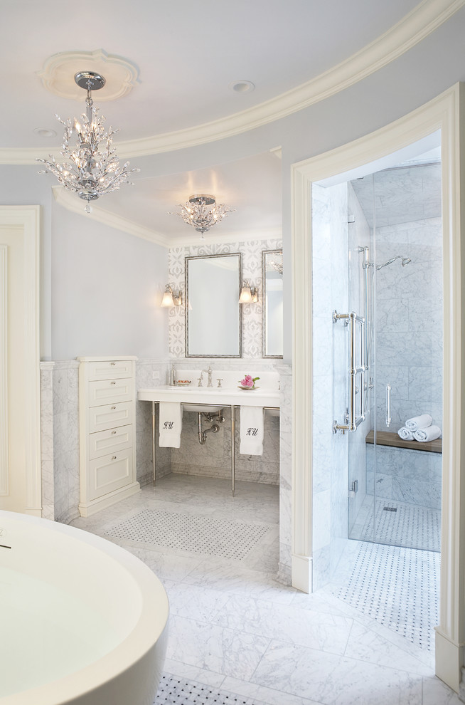This is an example of a traditional bathroom in Chicago with a console sink and a freestanding bath.