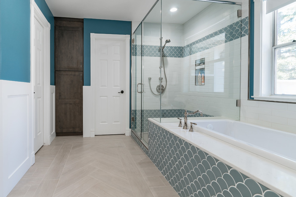 Large modern ensuite bathroom in Miami with shaker cabinets, brown cabinets, a japanese bath, an alcove shower, a one-piece toilet, white tiles, metro tiles, blue walls, ceramic flooring, an integrated sink, marble worktops, beige floors, a hinged door and white worktops.