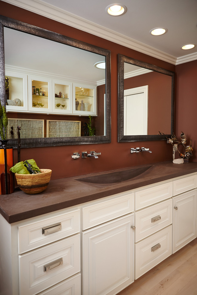 Example of a large minimalist master light wood floor freestanding bathtub design in Grand Rapids with a trough sink, white cabinets, concrete countertops, a bidet and brown walls