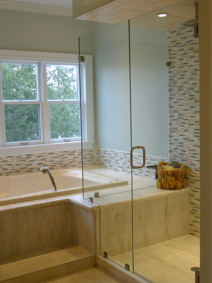 Design ideas for a medium sized traditional ensuite bathroom in Indianapolis with an integrated sink, flat-panel cabinets, white cabinets, a built-in bath, an alcove shower, a two-piece toilet, blue tiles, blue walls and ceramic flooring.
