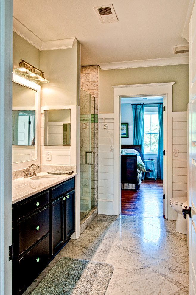 Inspiration for a farmhouse alcove shower remodel in Charleston with an undermount sink and black cabinets