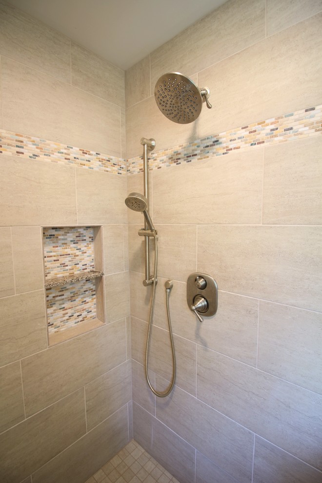 This is an example of a medium sized classic ensuite bathroom in Other with raised-panel cabinets, dark wood cabinets, a built-in shower, a two-piece toilet, beige tiles, porcelain tiles, green walls, porcelain flooring, a submerged sink, engineered stone worktops, brown floors and a hinged door.
