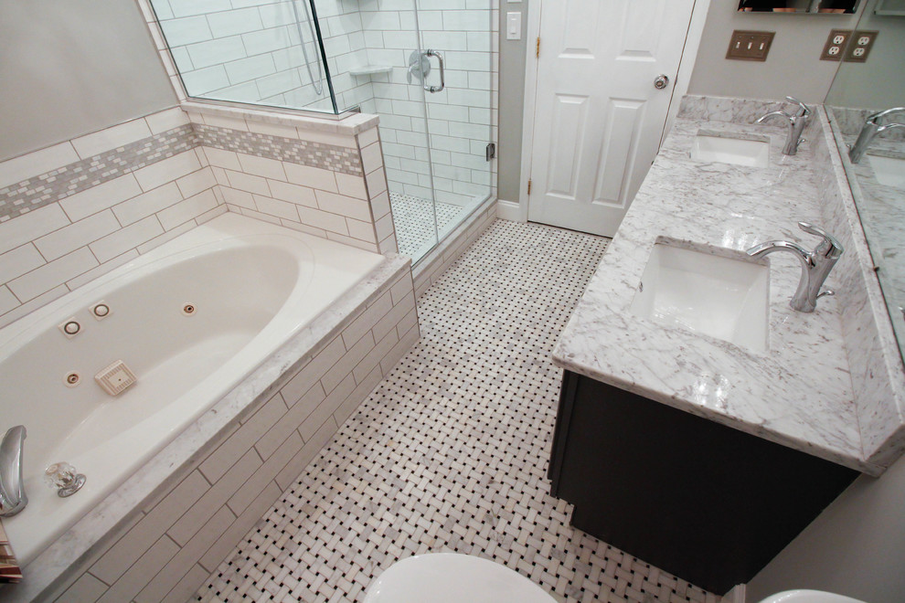 Inspiration for a mid-sized timeless master white tile and ceramic tile mosaic tile floor and white floor bathroom remodel in New York with flat-panel cabinets, gray cabinets, an urinal, gray walls, an undermount sink, marble countertops and a hinged shower door