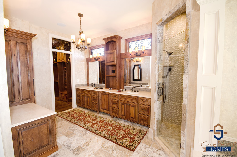This is an example of a large contemporary ensuite bathroom in Wichita with a submerged sink, raised-panel cabinets, medium wood cabinets, granite worktops, a submerged bath, a corner shower, a one-piece toilet, white tiles, ceramic tiles, beige walls, ceramic flooring and double sinks.