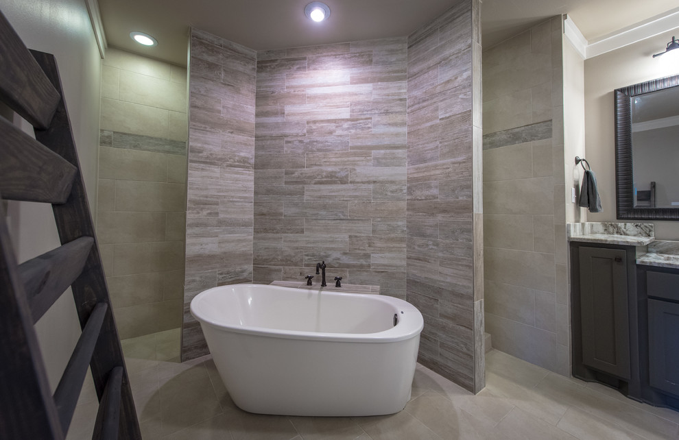 Inspiration for a large traditional ensuite bathroom in Little Rock with flat-panel cabinets, dark wood cabinets, a freestanding bath, a walk-in shower, a two-piece toilet, slate tiles, beige walls, slate flooring, a submerged sink, granite worktops and grey tiles.