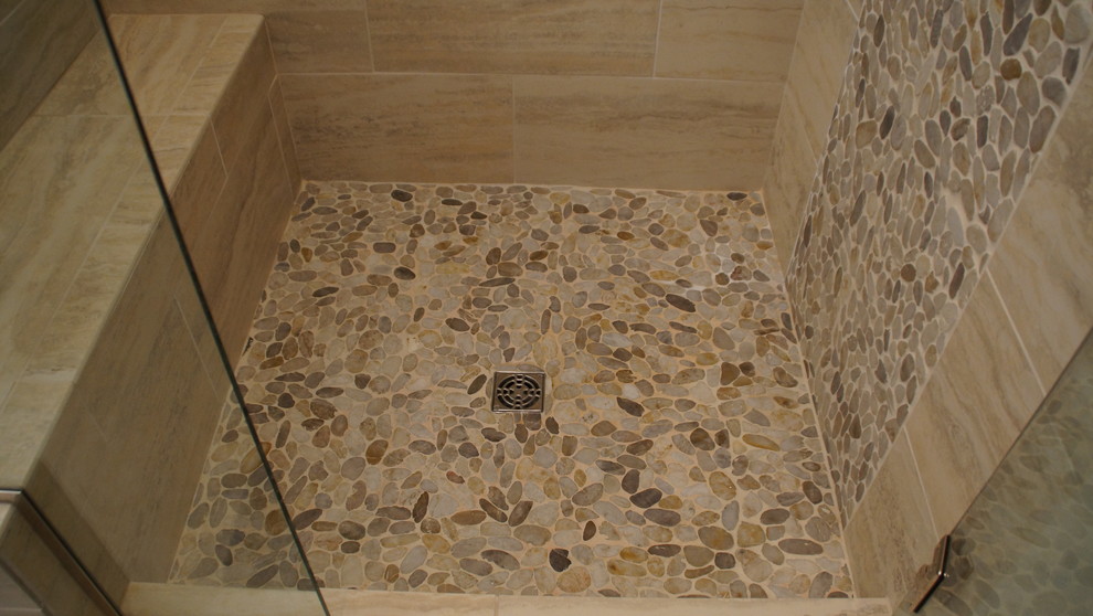 Example of a mid-sized transitional master multicolored tile and pebble tile travertine floor bathroom design in Kansas City with recessed-panel cabinets, white cabinets, a one-piece toilet, blue walls, an undermount sink and granite countertops