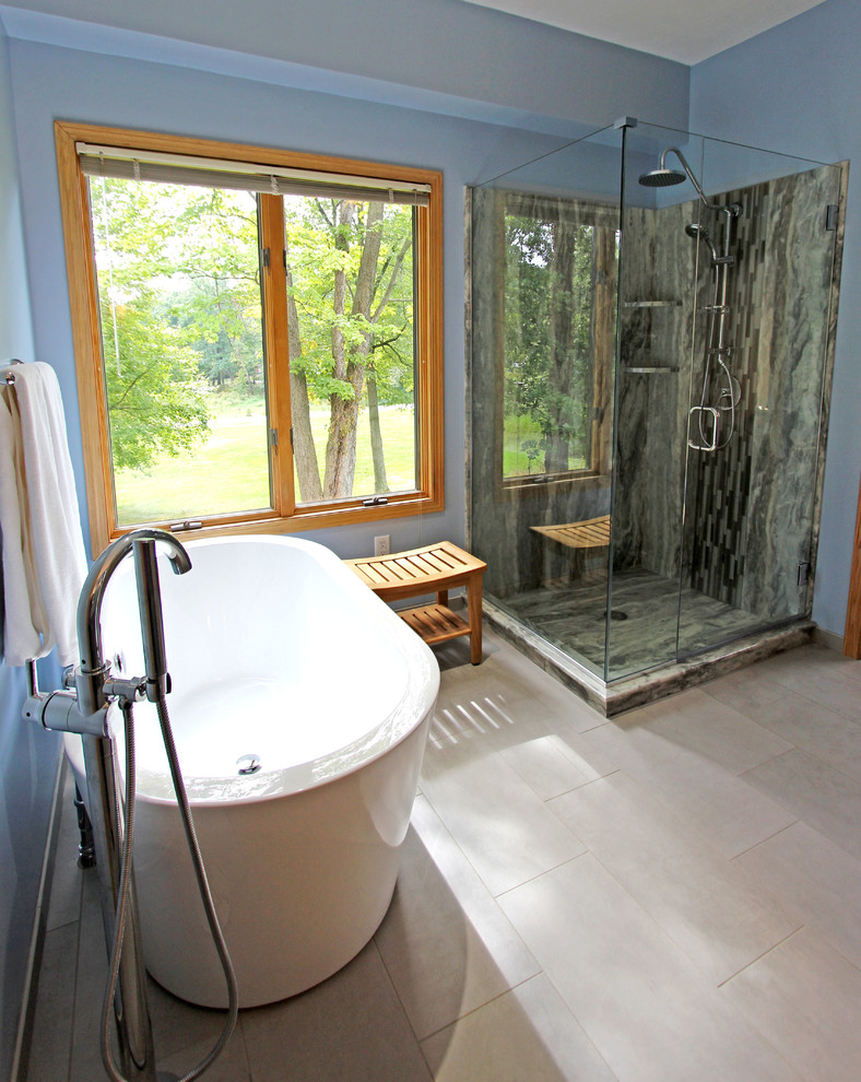 Mid-sized transitional master gray tile and glass tile bathroom photo in Cleveland with blue walls, an undermount sink, quartz countertops and a hinged shower door
