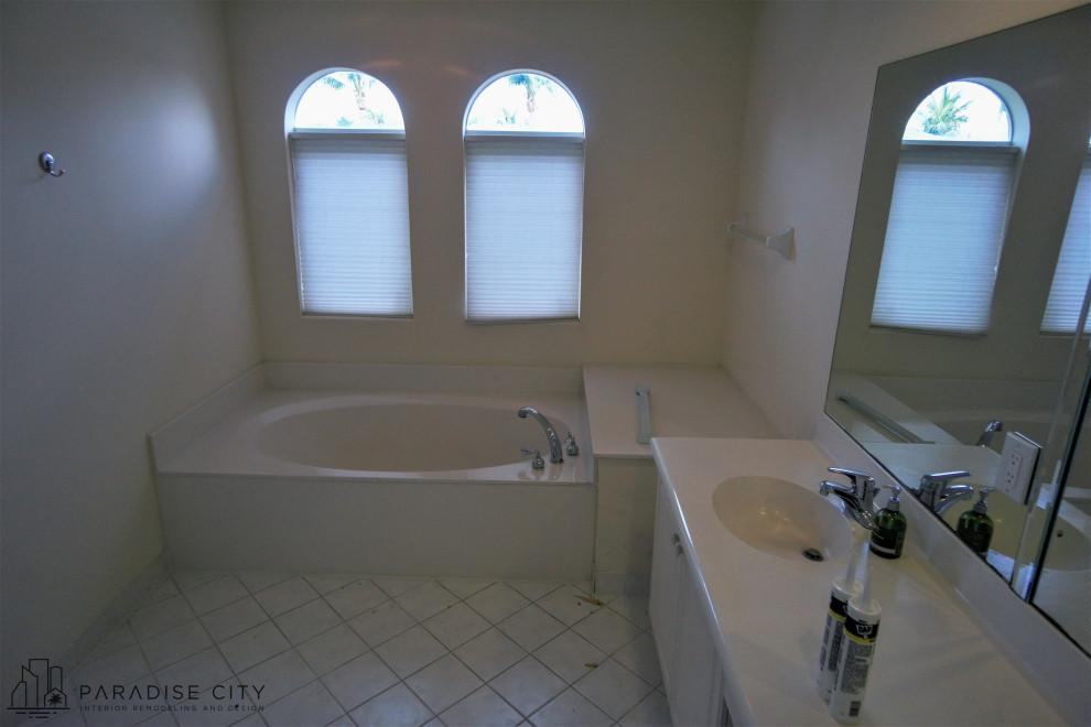 Large trendy master white tile and porcelain tile porcelain tile, white floor and double-sink bathroom photo in Miami with flat-panel cabinets, gray cabinets, a bidet, white walls, an integrated sink, glass countertops, black countertops, a niche and a floating vanity
