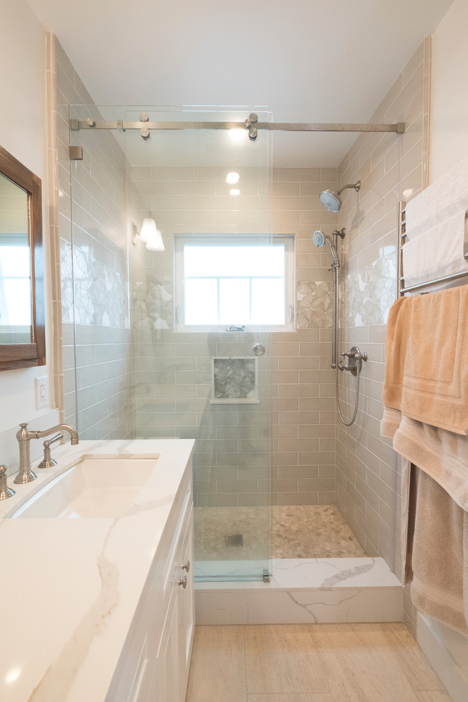 Mid-sized transitional master gray tile and subway tile porcelain tile and beige floor bathroom photo in Los Angeles with beaded inset cabinets, white cabinets, a two-piece toilet, white walls, an undermount sink, quartzite countertops and white countertops