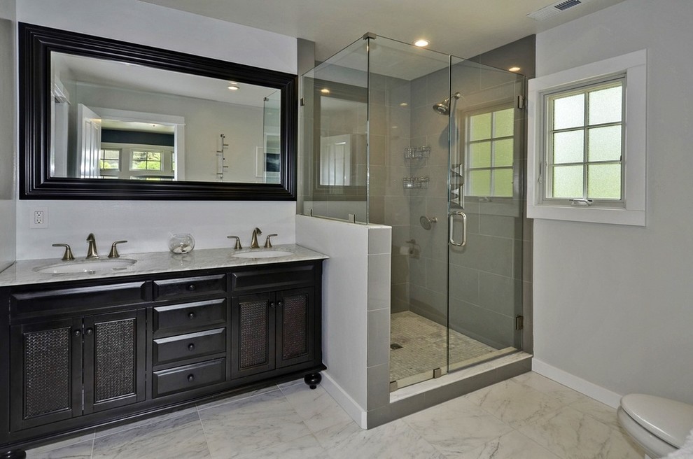 This is an example of a medium sized traditional ensuite bathroom in San Francisco with recessed-panel cabinets, black cabinets, a corner shower, white tiles, stone tiles, white walls, mosaic tile flooring and granite worktops.