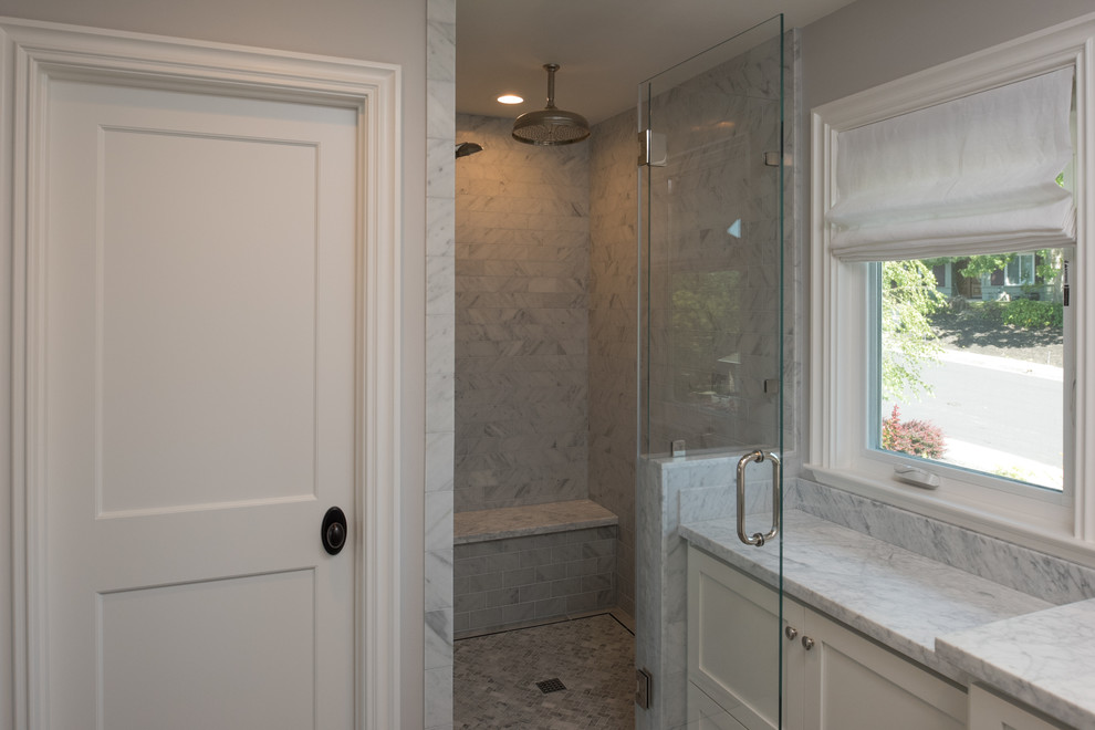 This is an example of a medium sized contemporary ensuite bathroom in San Francisco with shaker cabinets, white cabinets, a corner shower, white tiles and marble worktops.