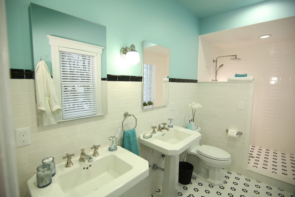 Inspiration for a transitional porcelain tile porcelain tile doorless shower remodel in Detroit with blue walls