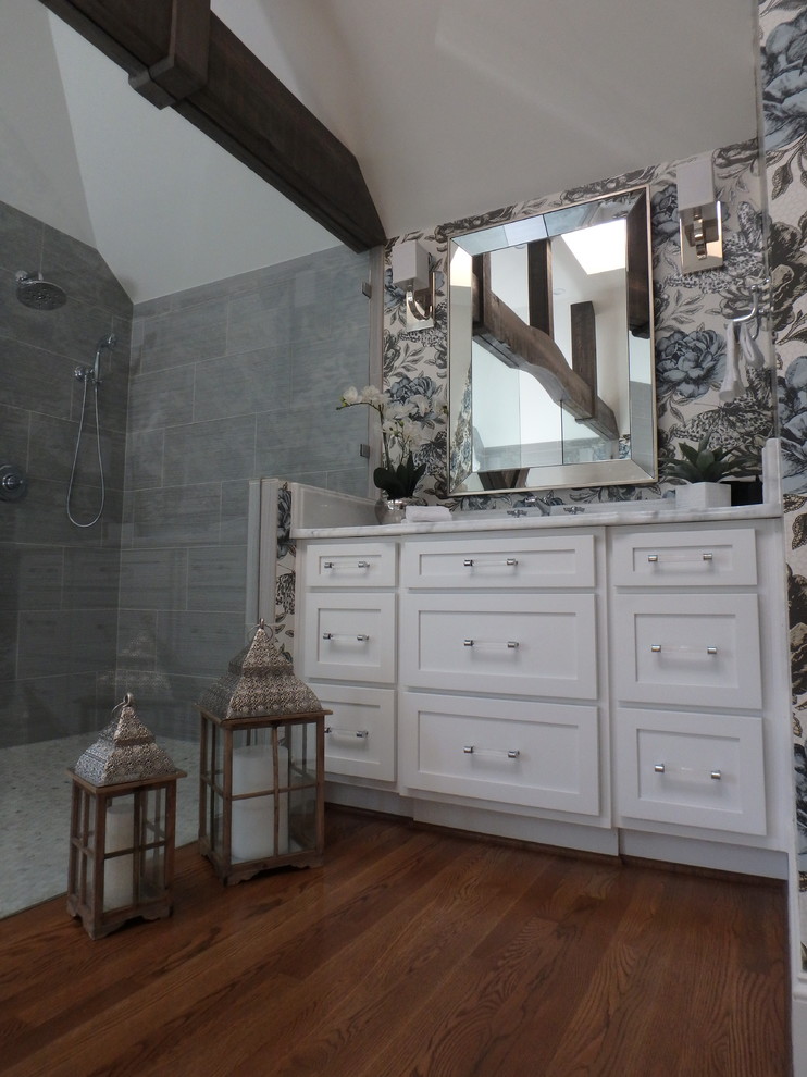 Medium sized traditional ensuite wet room bathroom in Other with shaker cabinets, white cabinets, a freestanding bath, a one-piece toilet, grey tiles, white walls, a submerged sink, marble worktops, mosaic tiles, marble flooring and white floors.