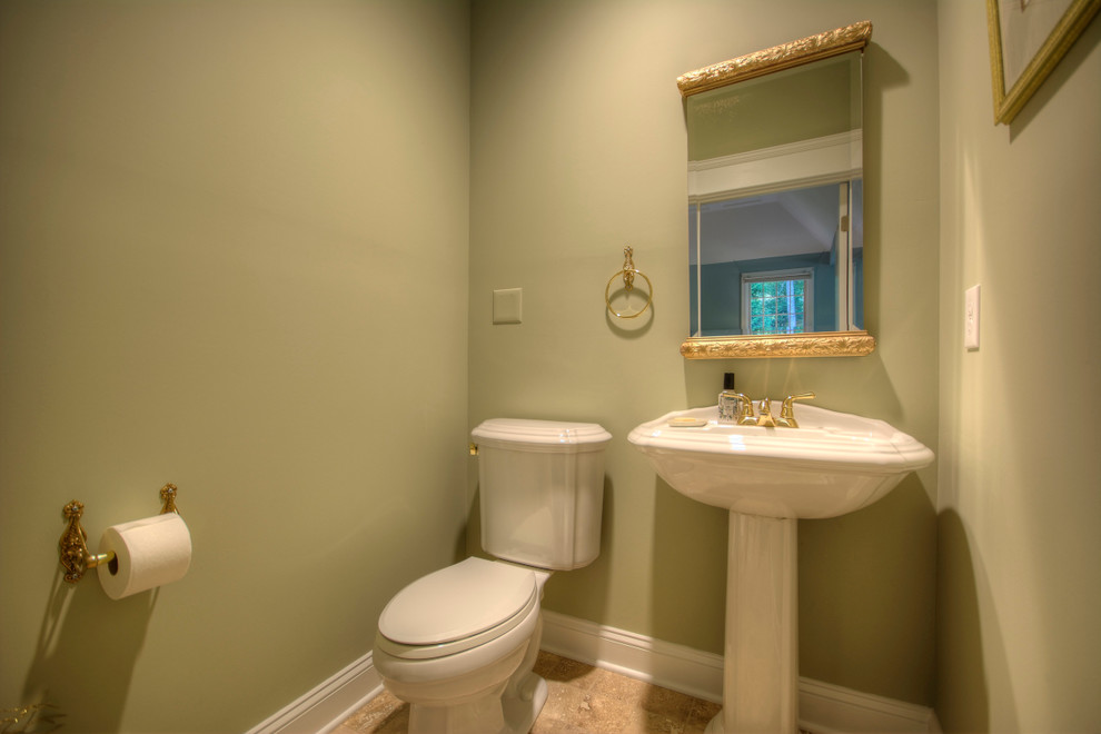 Inspiration for a small timeless 3/4 travertine floor bathroom remodel in Philadelphia with a two-piece toilet, green walls, a pedestal sink and solid surface countertops
