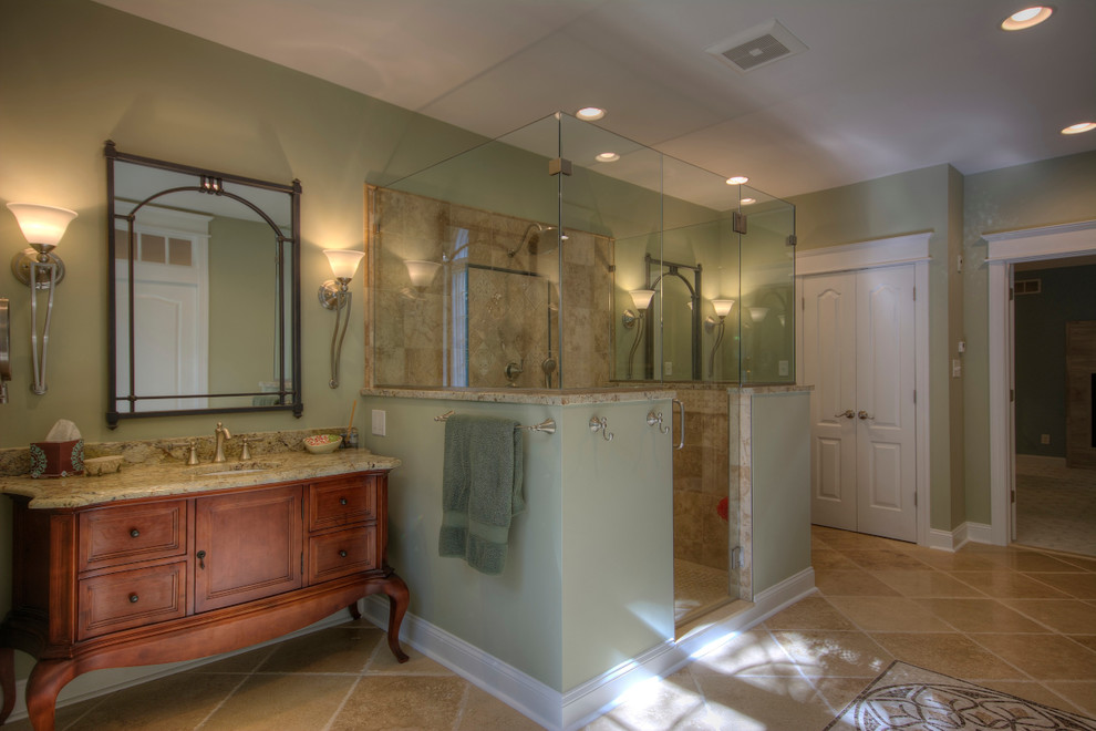 Example of a large classic master beige tile, green tile and porcelain tile travertine floor bathroom design in Philadelphia with green walls, medium tone wood cabinets, granite countertops and recessed-panel cabinets