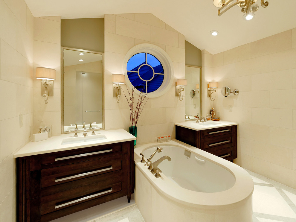 Large traditional ensuite bathroom in DC Metro with flat-panel cabinets, dark wood cabinets, beige tiles, stone tiles, beige walls, a submerged sink, a submerged bath, an alcove shower, a one-piece toilet, limestone flooring and limestone worktops.