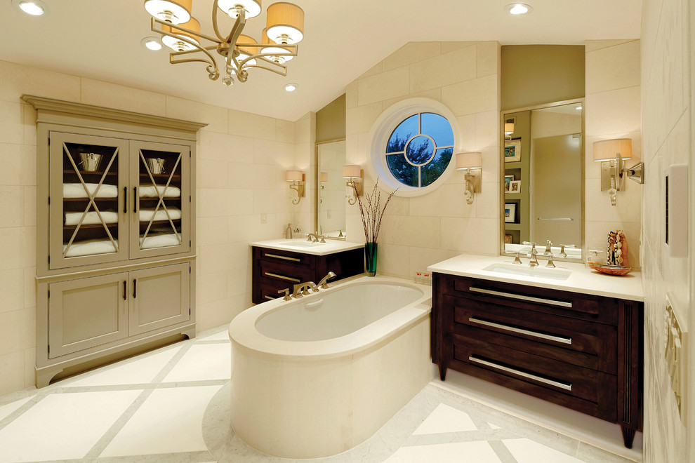 Inspiration for a large transitional master beige tile and limestone tile limestone floor alcove shower remodel in DC Metro with dark wood cabinets, beige walls, an undermount sink, flat-panel cabinets, an undermount tub, a one-piece toilet and limestone countertops