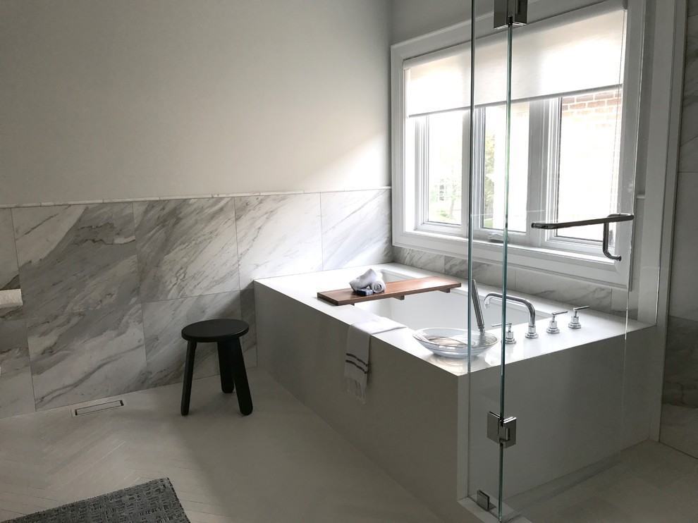 Example of a large minimalist master gray tile and porcelain tile porcelain tile and white floor corner shower design in Toronto with flat-panel cabinets, dark wood cabinets, an undermount tub, a one-piece toilet, white walls, an undermount sink, quartz countertops, a hinged shower door and white countertops