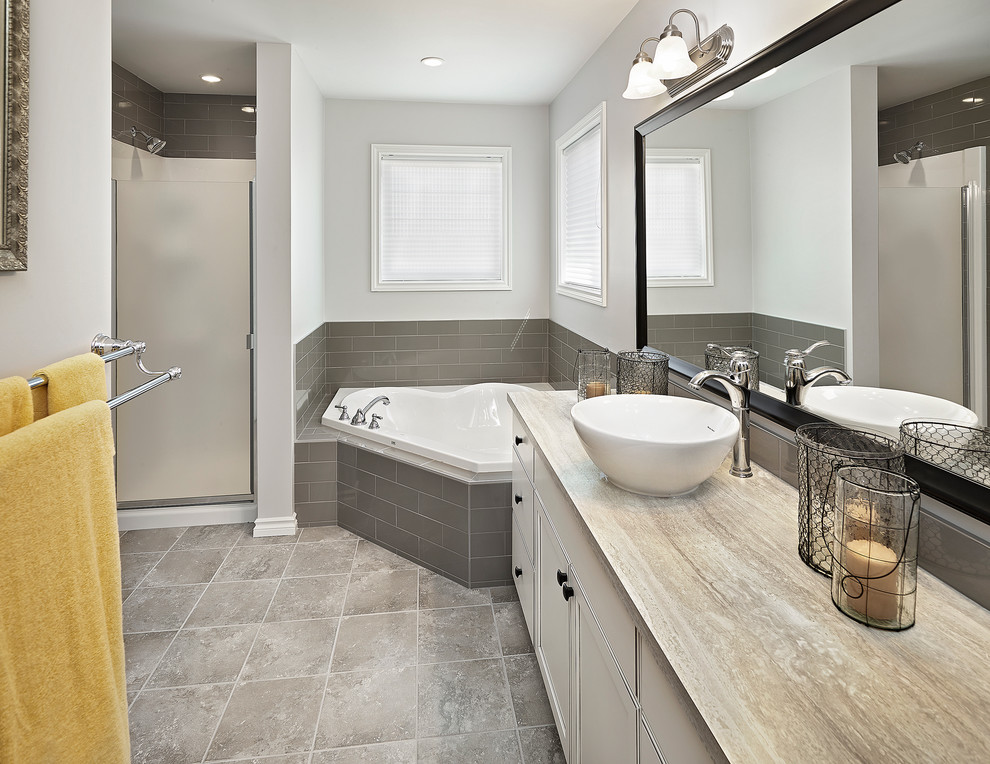 Example of a large classic master gray tile and ceramic tile ceramic tile bathroom design in Edmonton with a vessel sink, laminate countertops and a one-piece toilet