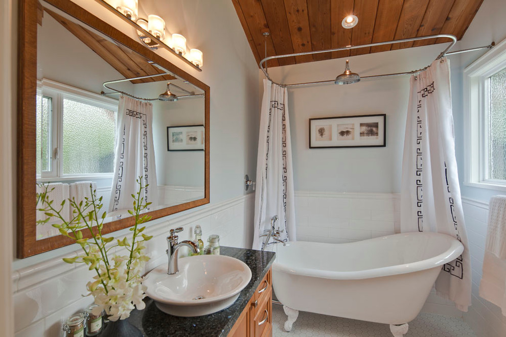 Inspiration for a transitional white tile and ceramic tile bathroom remodel in Vancouver with granite countertops, a vessel sink, recessed-panel cabinets and medium tone wood cabinets