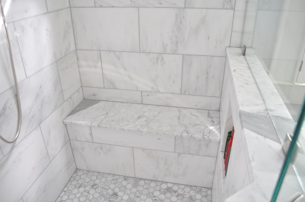 Freestanding bathtub - large traditional white tile marble floor freestanding bathtub idea in Atlanta with an undermount sink, raised-panel cabinets, white cabinets, marble countertops, gray walls and a two-piece toilet