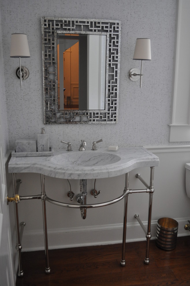 Small classic shower room bathroom in Atlanta with a pedestal sink, open cabinets, white cabinets, marble worktops, a freestanding bath, grey walls, medium hardwood flooring, a corner shower, a two-piece toilet and white tiles.