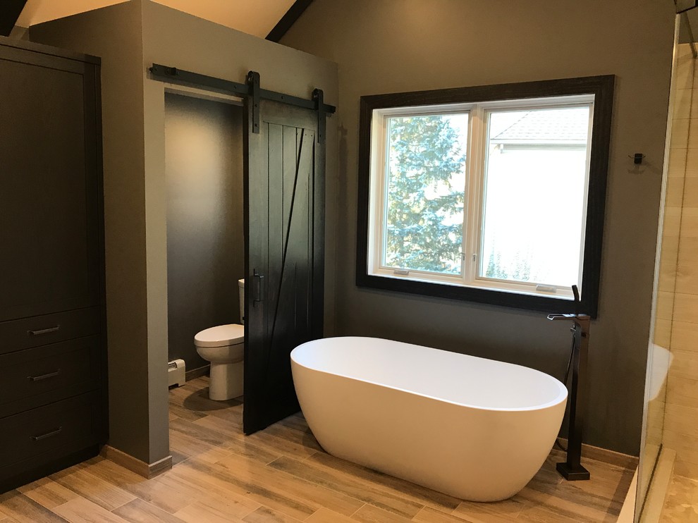 Bathroom - mid-sized rustic master light wood floor and beige floor bathroom idea in Philadelphia with flat-panel cabinets, dark wood cabinets, a one-piece toilet and brown walls