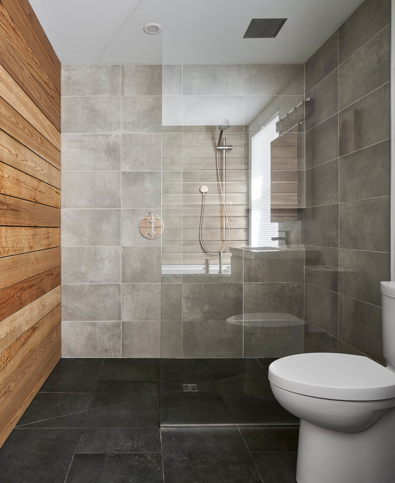 Bathroom - mid-sized contemporary master ceramic tile bathroom idea with flat-panel cabinets, medium tone wood cabinets, a two-piece toilet, white walls and a wall-mount sink