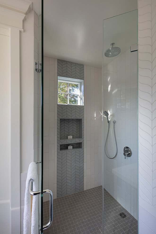 This is an example of a small farmhouse ensuite bathroom in San Francisco with shaker cabinets, blue cabinets, a freestanding bath, a corner shower, a two-piece toilet, white tiles, ceramic tiles, white walls, porcelain flooring, a submerged sink, engineered stone worktops, grey floors, a hinged door and white worktops.
