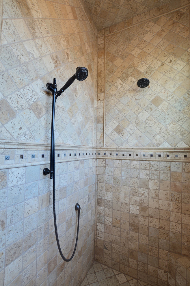 Design ideas for a mediterranean bathroom in Phoenix with an alcove shower, beige tiles, stone tiles and travertine flooring.