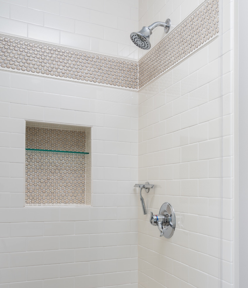 Example of a mid-sized transitional master beige tile and ceramic tile vinyl floor and brown floor bathroom design in Minneapolis with raised-panel cabinets, white cabinets, a two-piece toilet, beige walls, an undermount sink, granite countertops, a hinged shower door and beige countertops