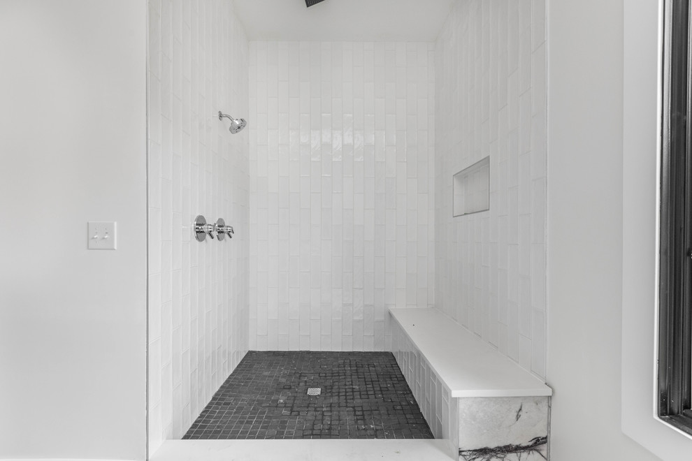 Large modern ensuite bathroom in Indianapolis with flat-panel cabinets, dark wood cabinets, a corner bath, a corner shower, a one-piece toilet, white tiles, metro tiles, grey walls, marble flooring, an integrated sink, quartz worktops, white floors, an open shower and white worktops.