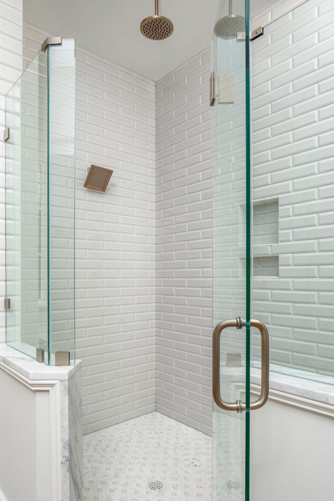 Large transitional master gray tile and subway tile corner shower photo in Charlotte with a hinged shower door