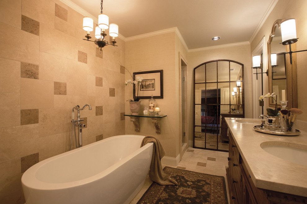 Inspiration for a medium sized mediterranean ensuite bathroom in Dallas with freestanding cabinets, distressed cabinets, a freestanding bath, an alcove shower, a two-piece toilet, beige tiles, travertine tiles, beige walls, travertine flooring, a submerged sink, marble worktops, beige floors and a hinged door.