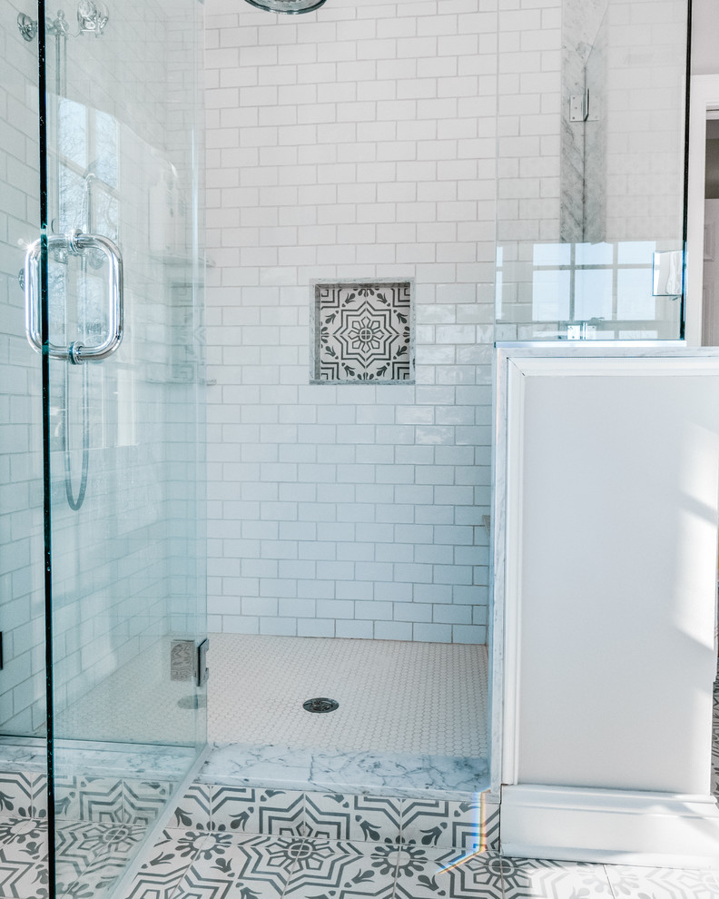 Bathroom - mid-sized transitional master white tile and ceramic tile cement tile floor and white floor bathroom idea in Philadelphia with raised-panel cabinets, blue cabinets, a two-piece toilet, beige walls, an integrated sink, marble countertops, a hinged shower door and gray countertops