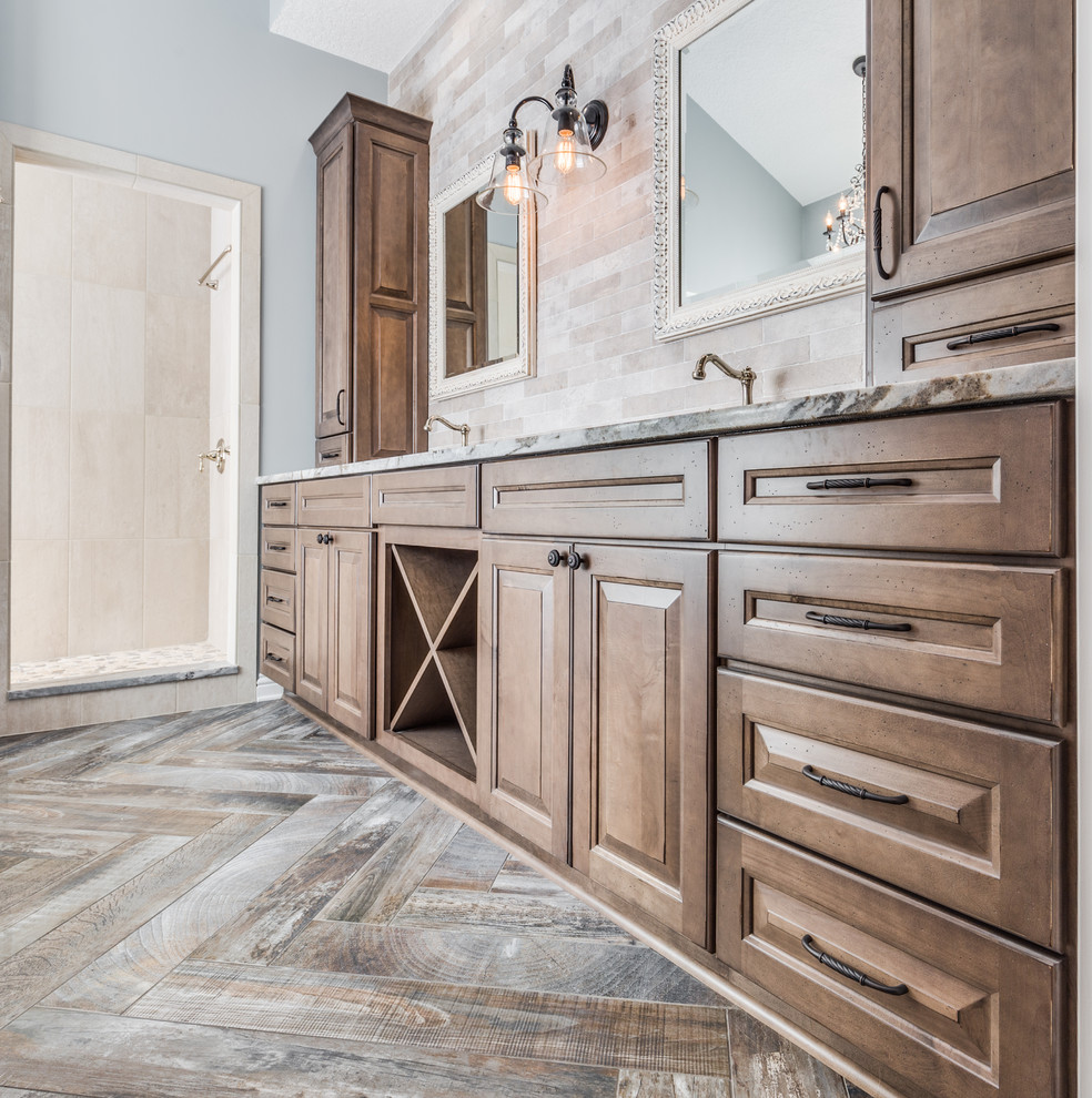 Inspiration for a rustic master multicolored tile and porcelain tile porcelain tile bathroom remodel in Jacksonville with raised-panel cabinets, medium tone wood cabinets, gray walls, an undermount sink and marble countertops