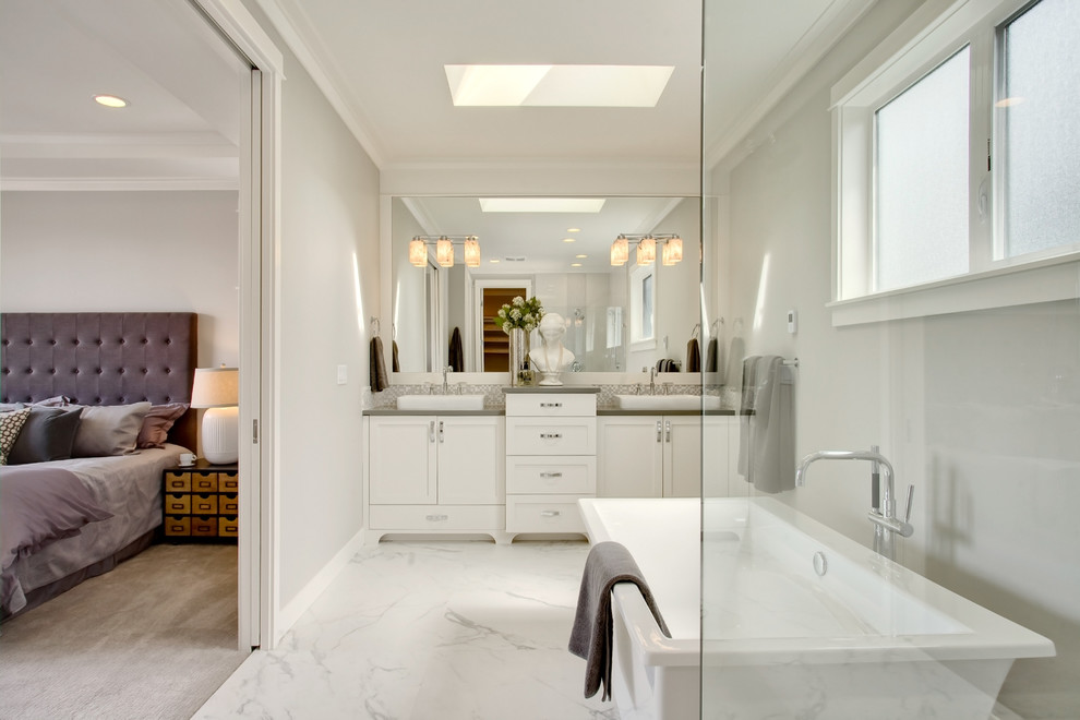 Example of an arts and crafts master white tile and mosaic tile porcelain tile bathroom design in Seattle with a vessel sink, recessed-panel cabinets, white cabinets, quartz countertops and gray walls