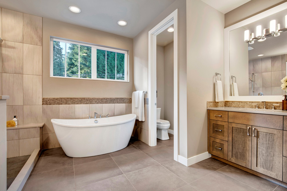 Example of a trendy master porcelain tile bathroom design in Seattle with a hinged shower door, brown cabinets, an undermount sink and quartzite countertops
