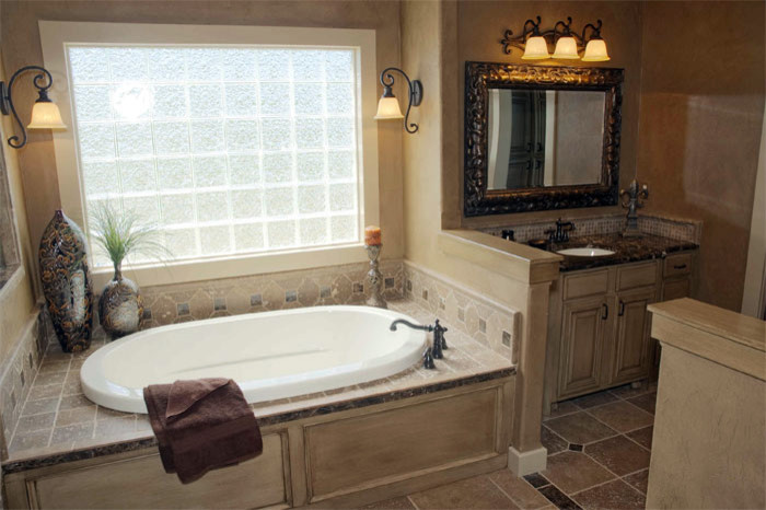 Bathroom - mid-sized traditional master beige tile and ceramic tile ceramic tile bathroom idea in Wichita with an undermount sink, recessed-panel cabinets, white cabinets, granite countertops, a one-piece toilet and beige walls