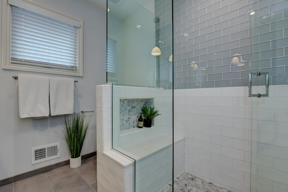 Example of a mid-sized trendy kids' white tile and mosaic tile cement tile floor, gray floor and double-sink bathroom design in San Francisco with raised-panel cabinets, brown cabinets, a one-piece toilet, white walls, an undermount sink, quartzite countertops, a hinged shower door and white countertops