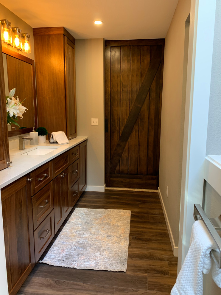 This is an example of a medium sized country ensuite bathroom in Seattle with shaker cabinets, a one-piece toilet, grey walls, vinyl flooring, a submerged sink, quartz worktops, beige worktops, a single sink and a built in vanity unit.