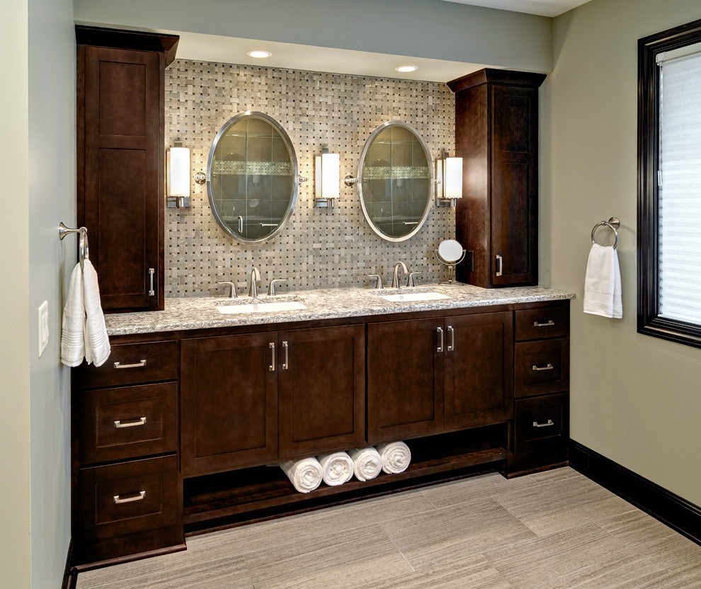 This is an example of a large classic ensuite bathroom in Minneapolis with a submerged sink, shaker cabinets, dark wood cabinets, granite worktops, a two-piece toilet, beige tiles, ceramic tiles, green walls and porcelain flooring.