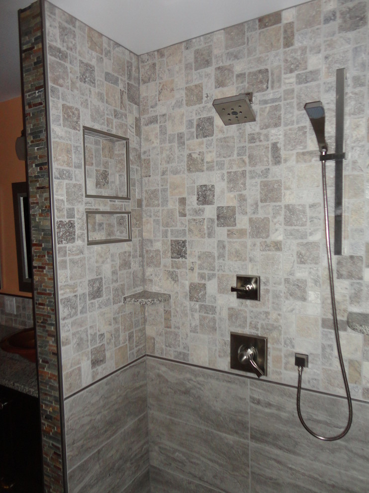 Cette image montre une grande salle de bain principale traditionnelle en bois foncé avec un placard à porte shaker, une baignoire posée, une douche à l'italienne, WC séparés, un carrelage gris, un carrelage de pierre, un mur orange, un sol en carrelage de porcelaine, une vasque et un plan de toilette en granite.