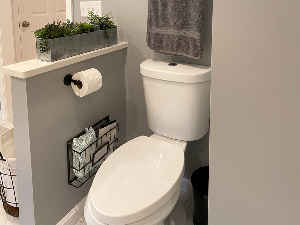 This is an example of an expansive cloakroom in Bridgeport with shaker cabinets, white cabinets, a two-piece toilet, white tiles, porcelain tiles, grey walls, porcelain flooring, a submerged sink, engineered stone worktops, white worktops and a freestanding vanity unit.